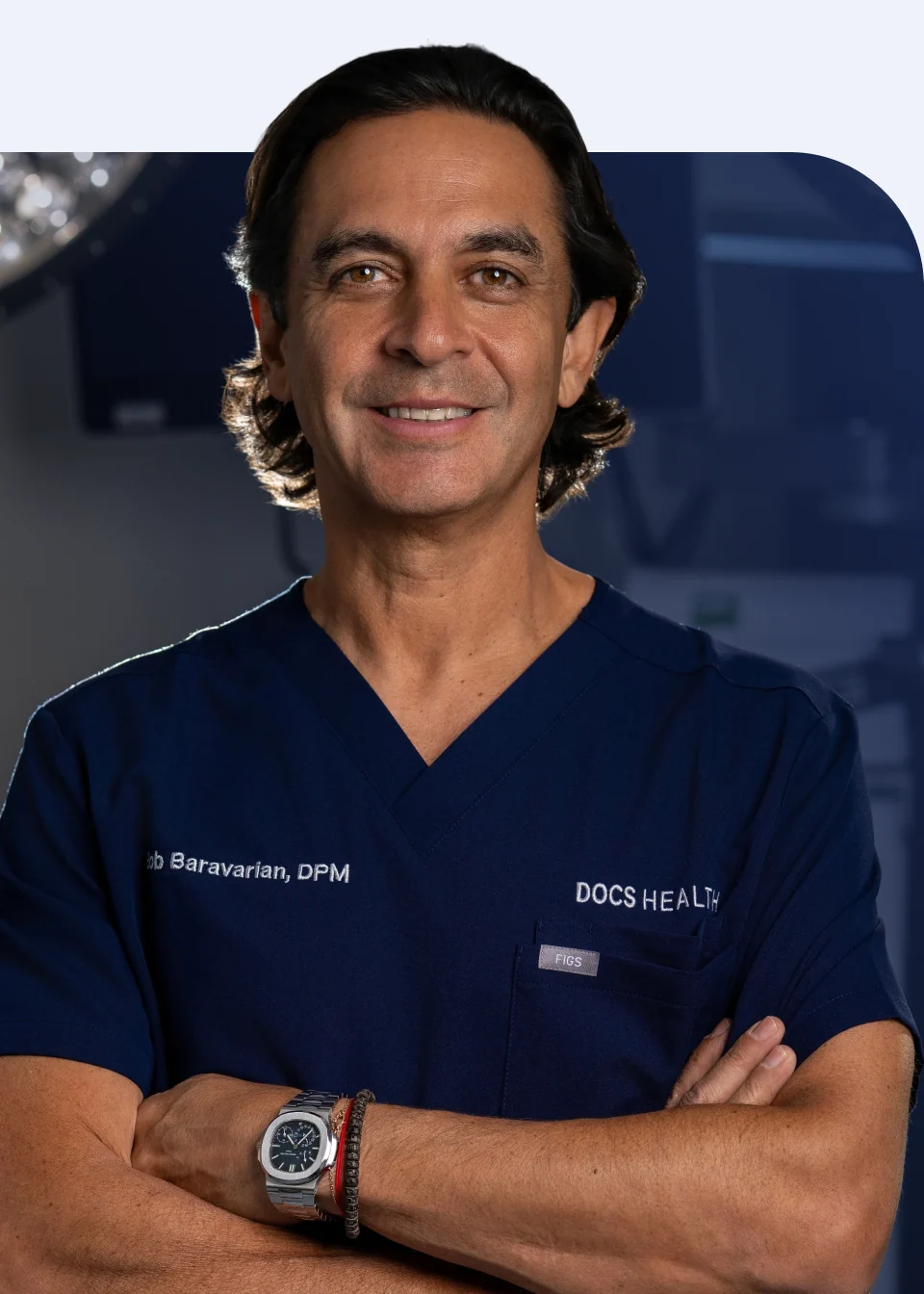 Dr. Bob Baravarian in the operating room, arms crossed